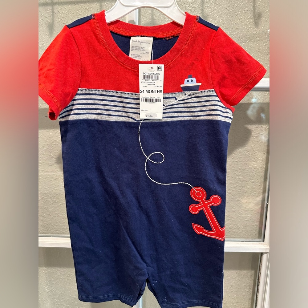 First Impressions baby boy one pc shortall; snaps at crotch. new. Size 24 mos